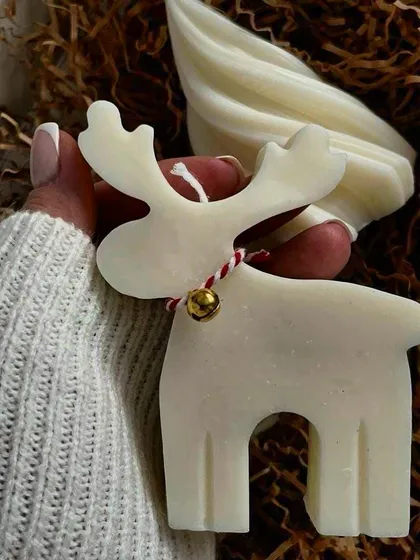 Add a touch of festive charm with this delightful Christmas reindeer candle. Made with high-quality soy wax, it's a whimsical addition to your holiday decor.