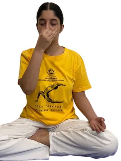 A student demonstrates the hand position (Vishnu Mudra) for Nadi Shodhana pranayama. This image, used for our workshop announcements, clearly shows the technique we teach.