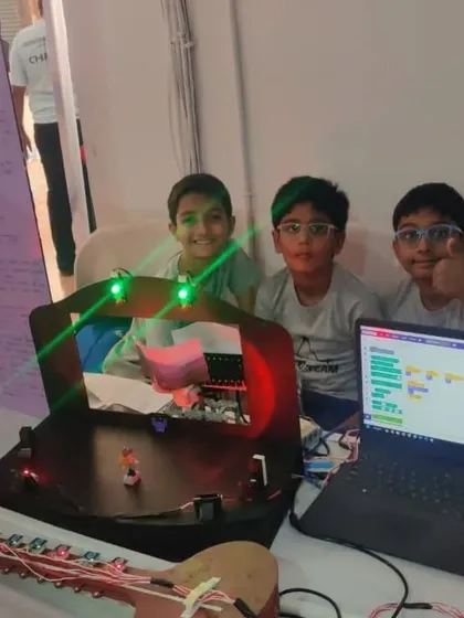 The 'Techno Team' with their award-winning FLL Challenge project. This interactive music and light show was built using a combination of coding and custom electronics.