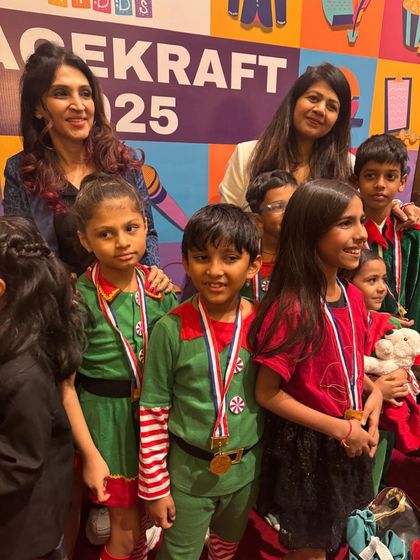 Our little elves and Christmas characters pose for a photo, still buzzing from the excitement of the show.