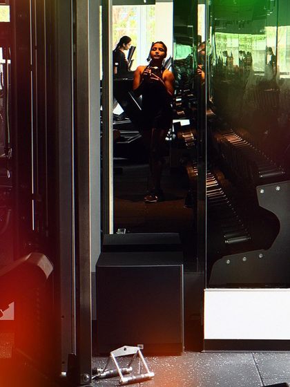 A reflection in the gym mirrors. The journey of growth is continuous, and every workout is a step forward.