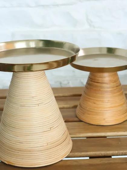 Our Swirl Symphony stands, featuring a spiraled wooden base and a metal top. Available in two sizes, these versatile pieces are perfect for serving, styling, or simply standing out.