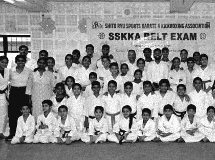 A throwback photo of our SSKKA family after a belt exam. We have a long history of fostering talent and building a strong, supportive community.