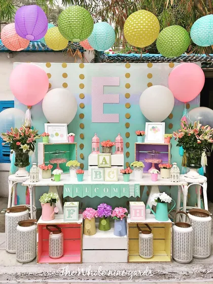 The dessert table for the "Ready to Pop" baby shower. I used colorful crates, fresh flowers, and a custom backdrop to create a beautiful and inviting display.
