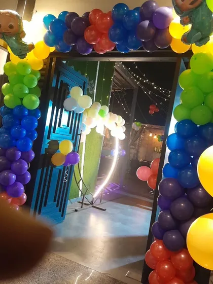 The entrance to the Cocomelon party, with a colorful balloon arch to welcome all the little guests.