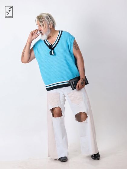 A candid, interactive pose that brings a sense of fun and personality to the fashion portfolio.