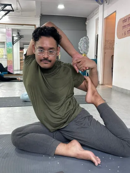 A student demonstrates a beautiful Eka Pada Rajakapotasana, showcasing the flexibility and openness that comes with a dedicated practice.