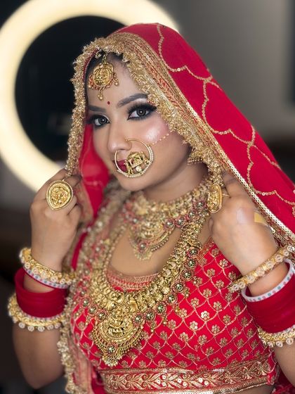 A stunning portrait of the bride looking directly at the camera. Her eyes are the focus, with a sharp winged liner and beautiful shimmer.