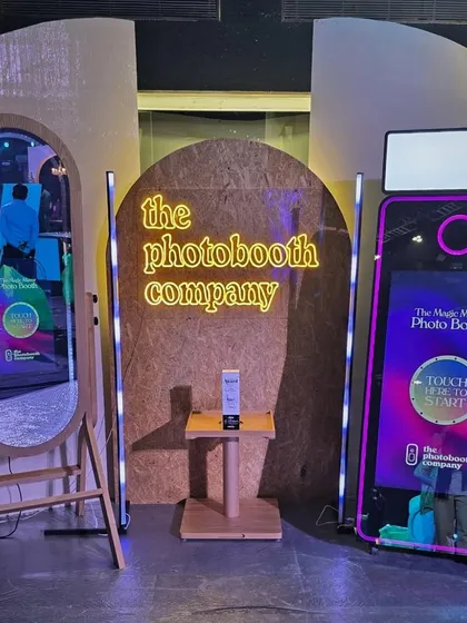 Here’s a look at our professional setup at a major event. We bring everything needed for a flawless experience, including our sleek Magic Mirror and Retro booths, studio lighting, and a dedicated host to manage it all.