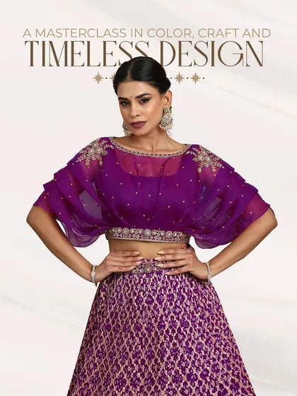"A masterclass in color, craft and timeless design" - this graphic perfectly describes our purple Banarasi and organza lehenga.