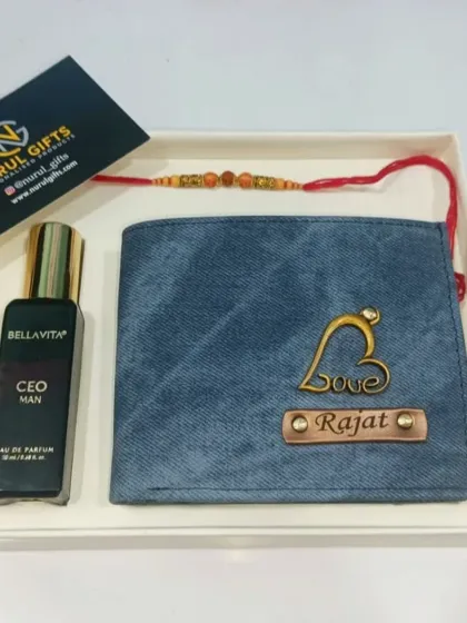 A lovely Raksha Bandhan gift set featuring a personalized denim wallet with a 'Love' charm, a custom rakhi, and a bottle of men's perfume, presented in a simple and elegant gift box.