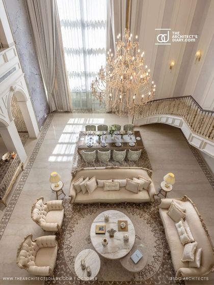 An overhead view of the living and dining area in The Ivory Royale reveals its grand scale and symmetrical layout. The space is unified by a consistent palette of ivory and gold, creating a cohesive and luxurious environment.