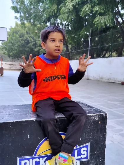 A young player passionately explains something during a break. Sports teach invaluable life lessons beyond the court, like communication, teamwork, and respect.