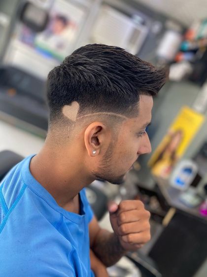 The initial phase of the heart design, carved out with a trimmer before the color is applied. This shows the foundation of the artwork.