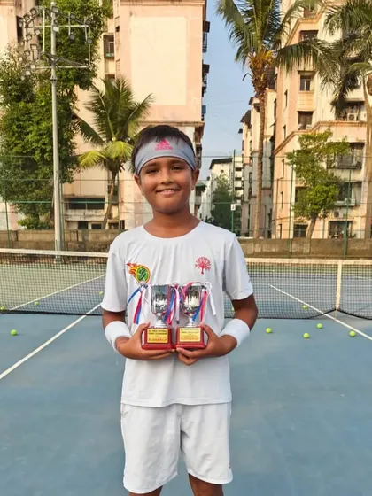 Aarav Chhallani holding his trophies for U-12 Singles and Doubles Runners-up at the All India National Series in Jaipur.