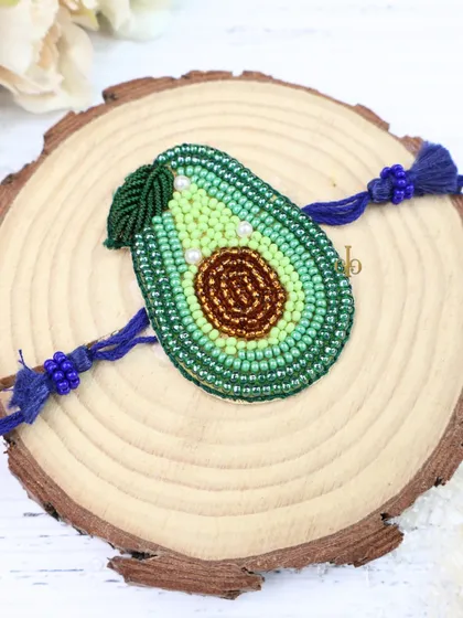 A healthy and cute choice! This beaded weave Rakhi is shaped like an avocado, perfect for a trendy and fun-loving sibling.