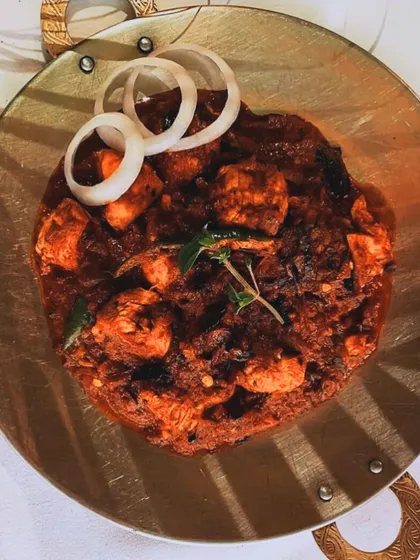 Straight from the hot griddle, our Chicken Tava is a semi-dry preparation packed with bold spices. Tender chicken pieces are seared to lock in the flavors, making it a perfect spicy starter.