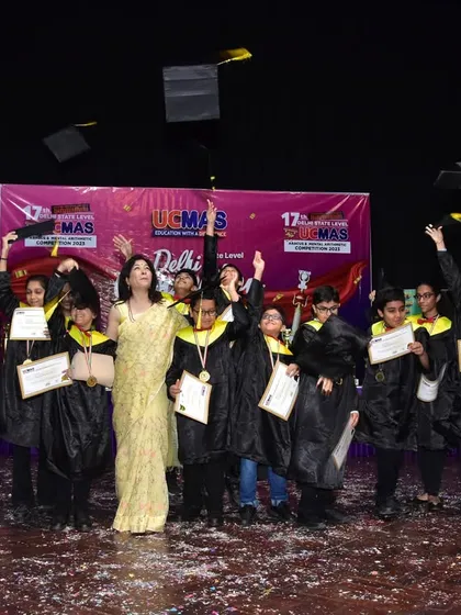 The joy of achievement. Our graduates celebrate at the 17th Delhi State Level Competition Awards Ceremony, tossing their caps in the air. This is a moment of pride for students, parents, and teachers.