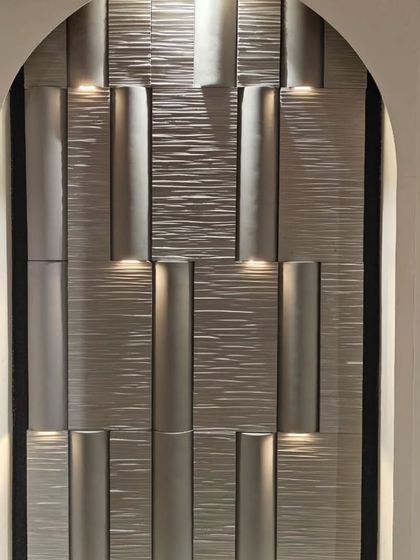 Another view of our wall cladding with concealed lighting, showing a different texture. This demonstrates the versatility of the system for creating unique architectural details.