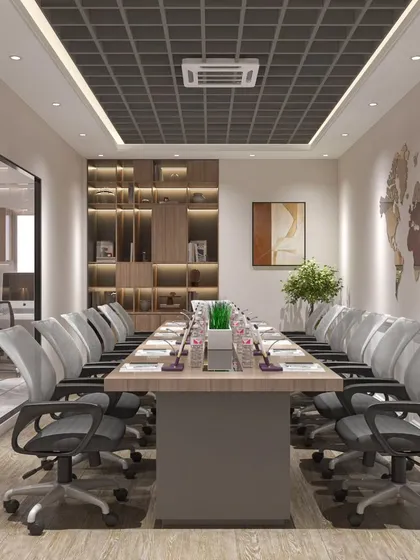 Another view of the conference room, showing the built-in wooden shelving for storage and display. The glass partition maintains an open feel while providing necessary privacy.
