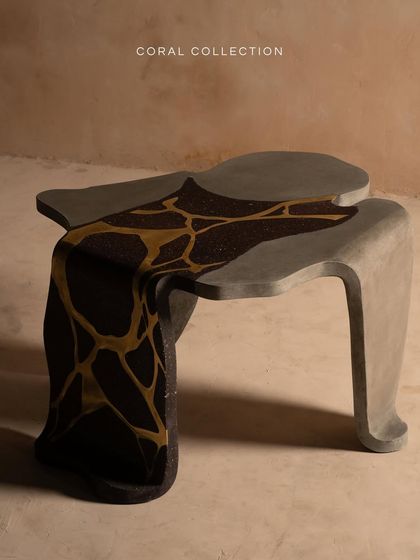 Our Coral Collection table features bold black terrazzo with luxurious gold inlay, fusing elegance and strength. Inspired by the fluid, organic movement of coral, this piece is both sculptural and functional.