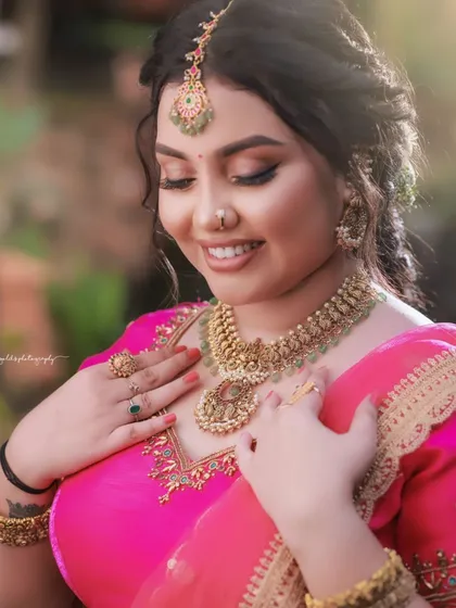 A serene and happy portrait. The bride's gentle smile and the soft focus of the background create a peaceful and romantic mood.