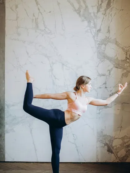 The beauty of yoga lies in its ability to create both strength and grace. A student demonstrates Natarajasana (Lord of the Dance Pose), a testament to the dedication and practice that our teacher training courses inspire.
