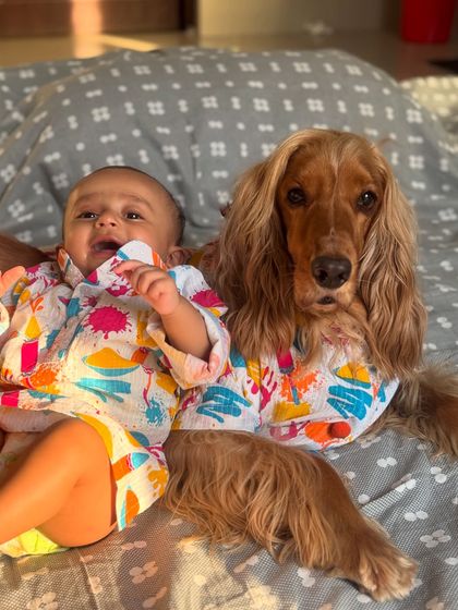 The happiest boys on Holi! Their smiles and matching outfits make for the perfect festive photo.