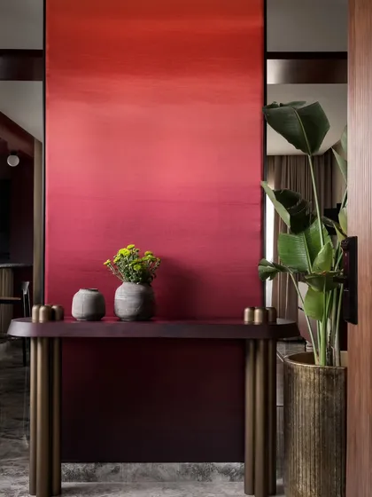 For the Scarlet Horizon residence, we designed a dramatic foyer with a custom ombré wall. This bold entrance makes a powerful first impression and sets a tone of vibrant, personality-driven design that unfolds throughout the home.