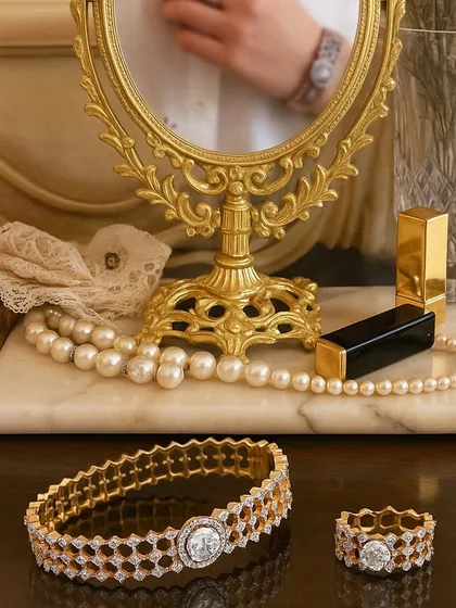 True luxury is jewellery that feels like a part of you. Here, a custom honeycomb bracelet and matching ring, both set with brilliant diamonds, rest on a vanity. I design each piece to integrate seamlessly into your life, adding a touch of personal elegance to your daily moments.