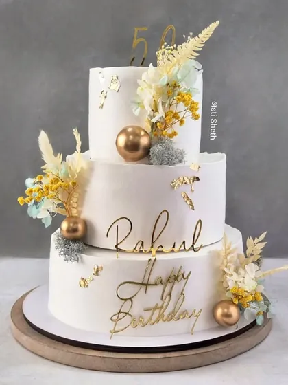 A grand 6kg, three-tiered cake for a 50th birthday. This Cherry Chocolate cake is a perfect example of a minimalistic yet stunning centerpiece.