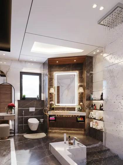 A stunning bathroom design with dark marble floors, a floating vanity, a rain shower, and a separate dressing table.