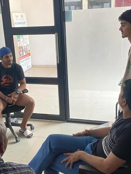 Parental involvement is crucial. Here, our coaches and staff engage in a discussion with an athlete and his family to align on his development goals.