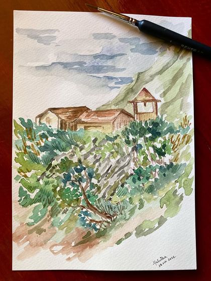 Painted on a fresh morning in Tirthan Valley, this watercolor captures the rustic charm of Himachali architecture against a backdrop of lush greenery. It’s a reminder of the simple beauty of being alive.