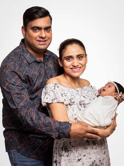 Another take from a classic family studio session, capturing the pure happiness of new parents. I provide gentle guidance to ensure you look natural and feel comfortable.