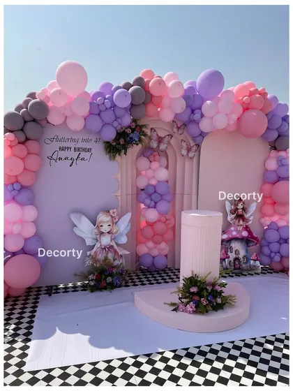 A straight-on view of the enchanting fairy party backdrop.