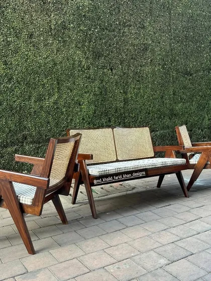 This is my take on the iconic Pierre Jeanneret "Kangaroo" set, including a two-seater sofa and matching lounge chairs. Built from solid teak with hand-woven cane and custom upholstery, this set is perfect for hotel lobbies or high-end lounge areas.