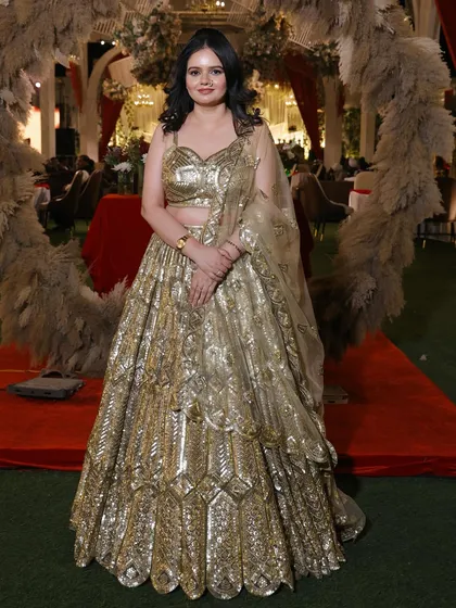 A poised and elegant full-length photo, showcasing the entire glamorous look.