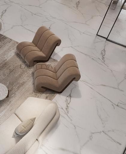 An aerial view of a living area concept, showcasing our approach to space planning with curved furniture. The sculptural chairs and sofas create a soft, inviting flow against the clean lines of the white marble floor.