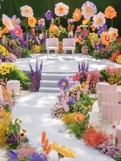 Surrounded by vibrant blooms and enchanting floral displays, the "Bloom" wedding decor transformed the special day into a whimsical, flower-filled dreamscape.