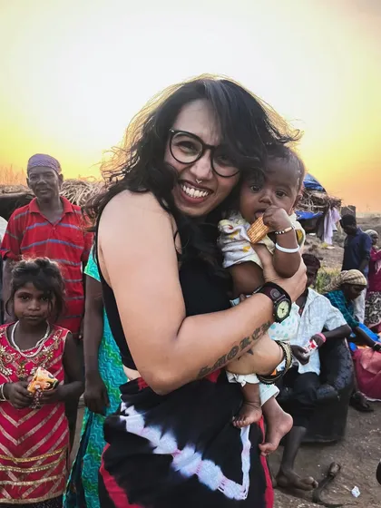 My music is a vehicle for kindness. A portion of my earnings goes toward helping underprivileged people and stray animals. This moment, sharing a hug with a child, represents the true purpose behind my art.