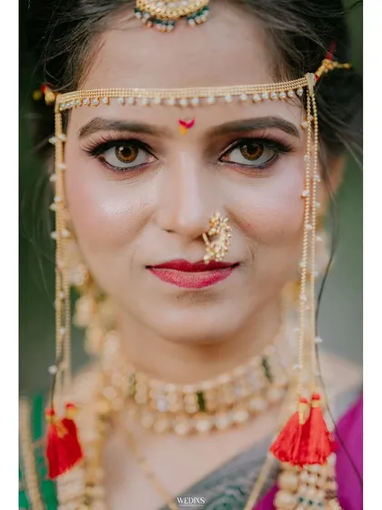 A close-up bridal portrait highlighting the stunning details of traditional Maharashtrian jewellery and makeup. I focus on creating artistic and elegant shots that you will cherish forever.
