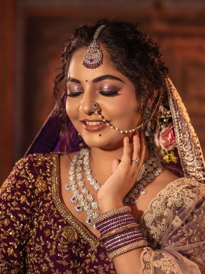 Another beautiful close-up capturing the essence of a bride's happiness. The diamond jewellery pairs perfectly with the detailed embroidery of the lehenga, creating a sparkling and unforgettable look.
