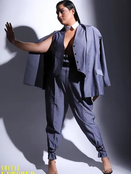 A full length shot showcasing the complete outfit for Sakshi Sindwani's magazine feature. The tied ankle detail on the trousers adds a unique and contemporary twist to the classic power suit.