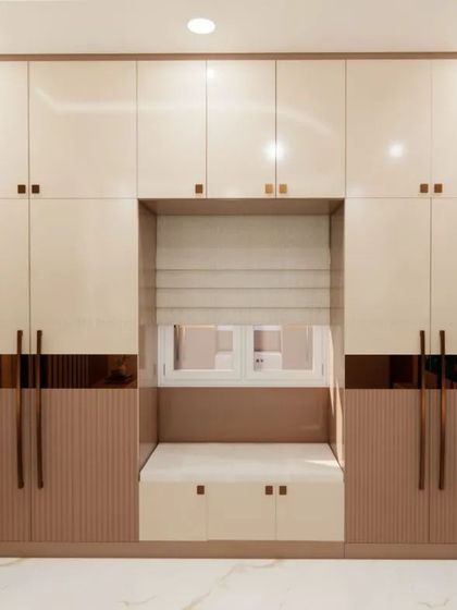 A bedroom wardrobe with an integrated window seat, providing a cozy nook for reading or relaxing.