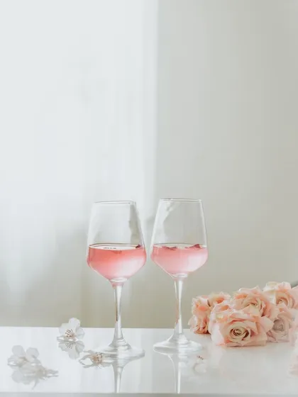 A slightly different composition of the rosé wine glasses, showing how small adjustments in angle can change the feel of a high-key shot.