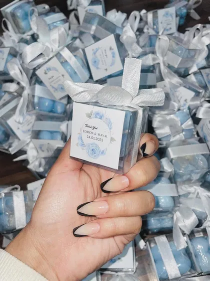 These blue mini bubble candles were created for a wedding, complete with custom "Thank You" tags featuring a blue floral design.
