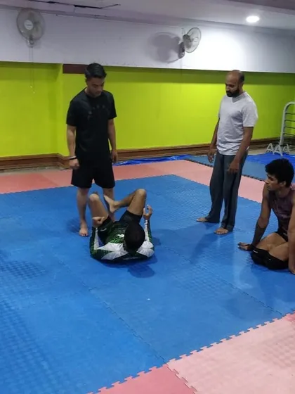 We welcome guest instructors to share their knowledge. Here, Coach Sharmaji from BJJ Trivandrum is demonstrating a technique to our study group.