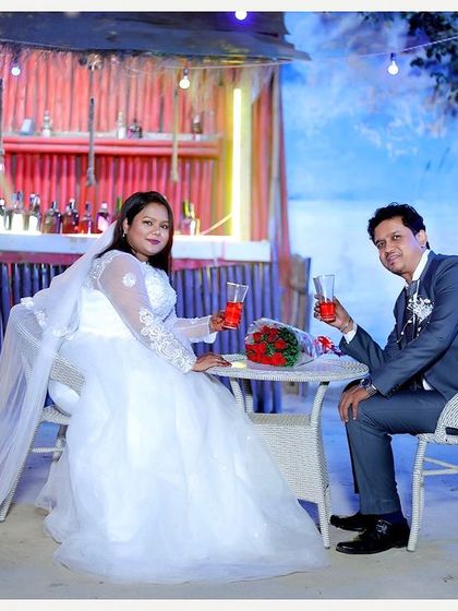 Our beach-shack-themed bar setup is perfect for celebratory shoots, like this post-wedding photo, adding a fun and relaxed vibe.