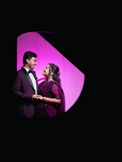 A creative and artistic shot of a couple framed in a geometric shape of light.